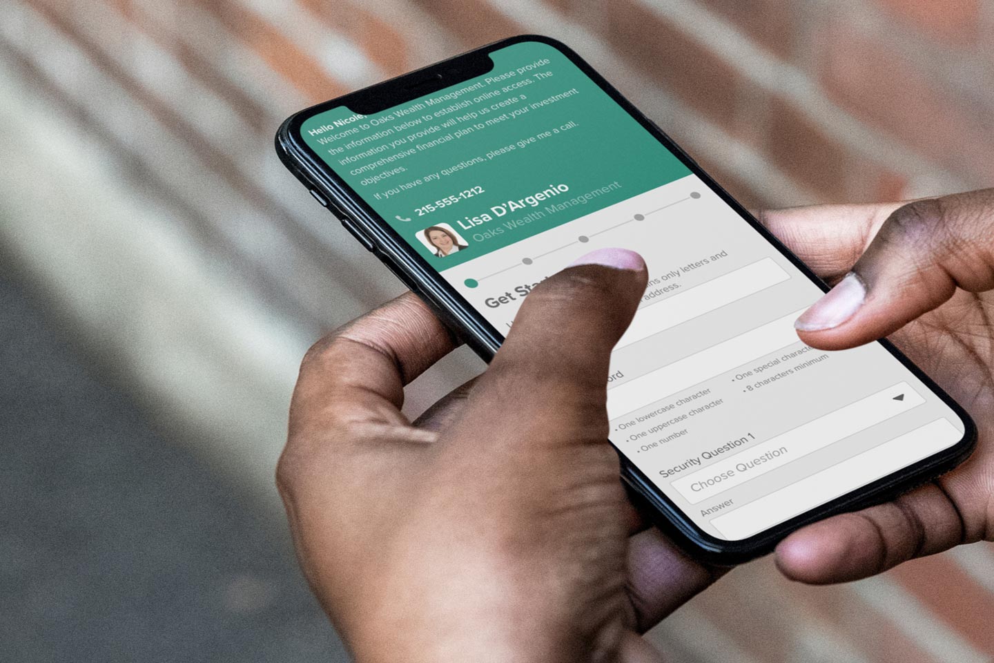 Person holding a phone with their financial advisor's information